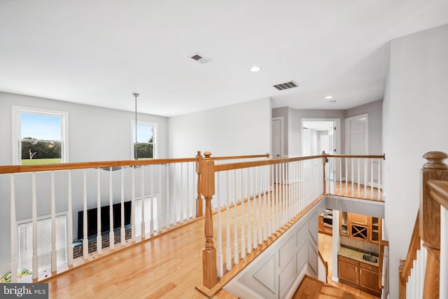 301 Nottingham Ln, Queenstown, MD 21658 - hallway featuring light wood-type flooring, an upstairs landing, and recessed lighting