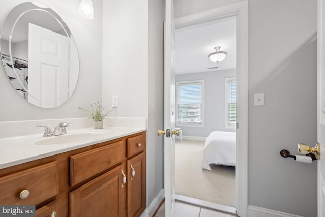 301 Nottingham Ln, Queenstown, MD 21658 - bathroom with vanity, ensuite bath, and tile patterned flooring