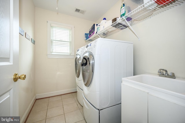 301 Nottingham Ln, Queenstown, MD 21658 - washroom with washer and clothes dryer and light tile patterned flooring
