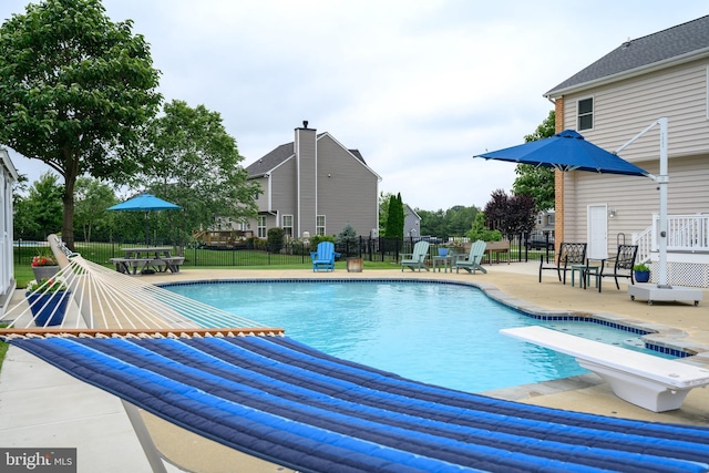 301 Nottingham Ln, Queenstown, MD 21658 - view of swimming pool featuring a patio area and a diving board