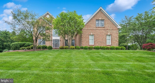 56 Saxon Way, Skillman, NJ 08558 - traditional-style home featuring a front yard and brick siding
