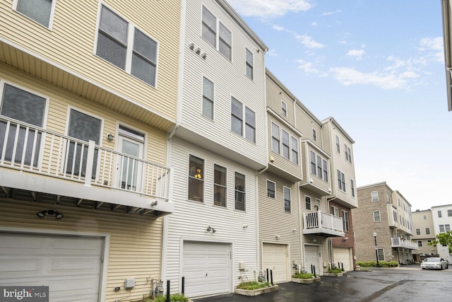 311 I St SE, Washington, DC 20003 - view of building exterior with a garage and a residential view