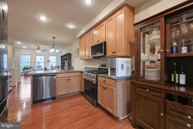 311 I St SE, Washington, DC 20003 - kitchen featuring appliances with stainless steel finishes, a peninsula, light wood-style flooring, ceiling fan, and recessed lighting