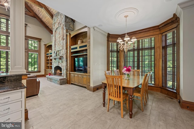 601 Utterback Store Rd, Great Falls, VA 22066 - dining room with a chandelier, baseboards, wooden ceiling, built in features, and decorative columns