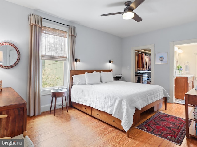 19 E Del Ray Ave E, Alexandria, VA 22301 - bedroom with multiple windows, light wood-type flooring, connected bathroom, and a spacious closet