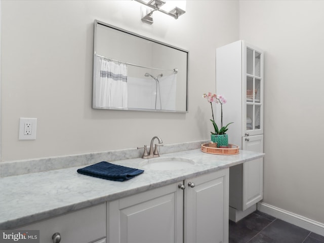 19 E Del Ray Ave E, Alexandria, VA 22301 - full bath featuring vanity, tile patterned flooring, and a shower with shower curtain