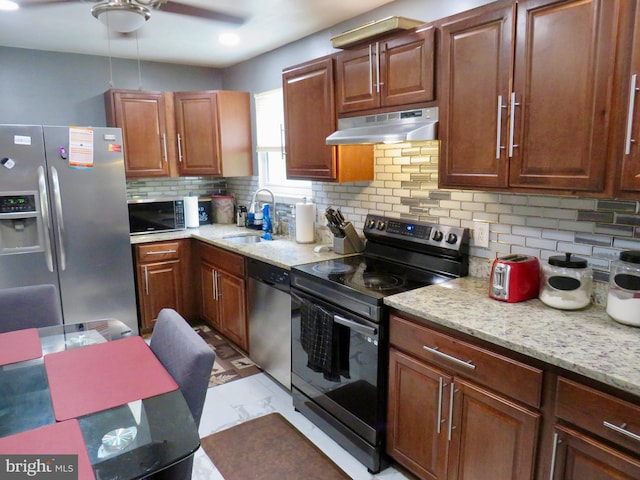 494 Kenilworth Ct, Glen Burnie, MD 21061 - kitchen featuring stainless steel appliances, a sink, under cabinet range hood, and tasteful backsplash