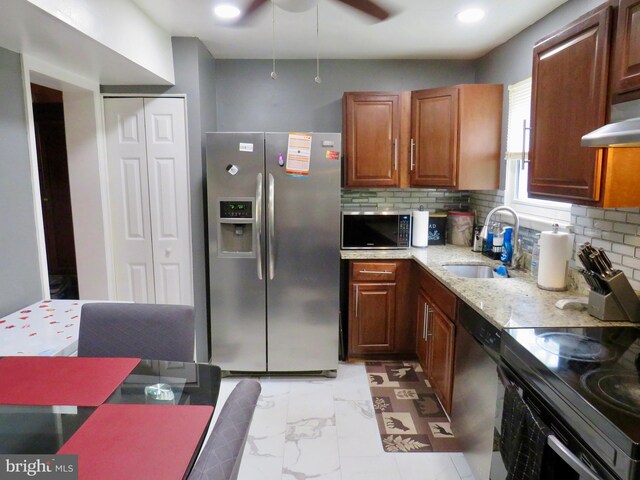 494 Kenilworth Ct, Glen Burnie, MD 21061 - kitchen featuring stainless steel appliances, a sink, light stone countertops, backsplash, and under cabinet range hood