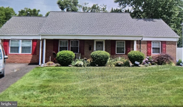 114 Nottingham Dr, Willingboro, NJ 08046 - view of front of house featuring a front lawn, brick siding, and roof with shingles