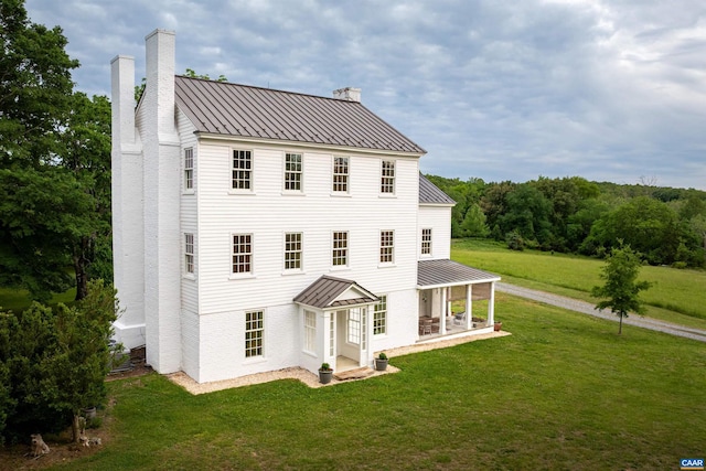 3276 Buckingham Springs Rd, Dillwyn, VA 23936 - rear view of house with a chimney, a standing seam roof, metal roof, and a lawn