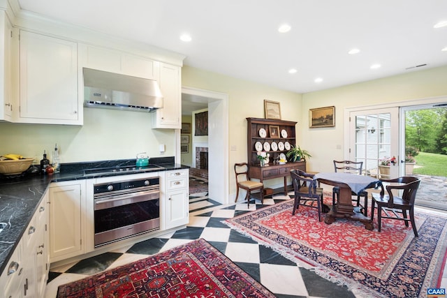 3276 Buckingham Springs Rd, Dillwyn, VA 23936 - kitchen featuring stainless steel oven, under cabinet range hood, black electric cooktop, light floors, and dark countertops