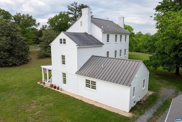 3276 Buckingham Springs Rd, Dillwyn, VA 23936 - rear view of property with a standing seam roof, metal roof, a chimney, and a lawn
