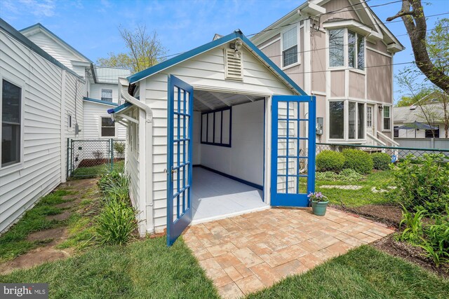 204 W Chew Ave, Saint Michaels, MD 21663 - back of house featuring fence and an outdoor structure
