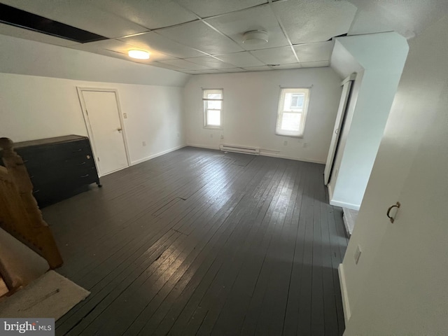 19 S Gold St, Shamokin, PA 17872 - unfurnished room with a baseboard heating unit, baseboards, a drop ceiling, and dark wood finished floors