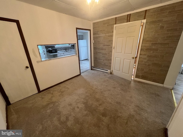 19 S Gold St, Shamokin, PA 17872 - unfurnished room featuring carpet floors and a baseboard heating unit