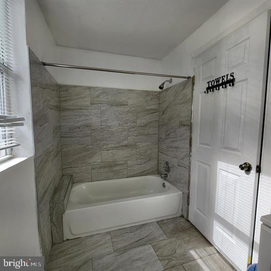 full bath featuring shower / tub combination