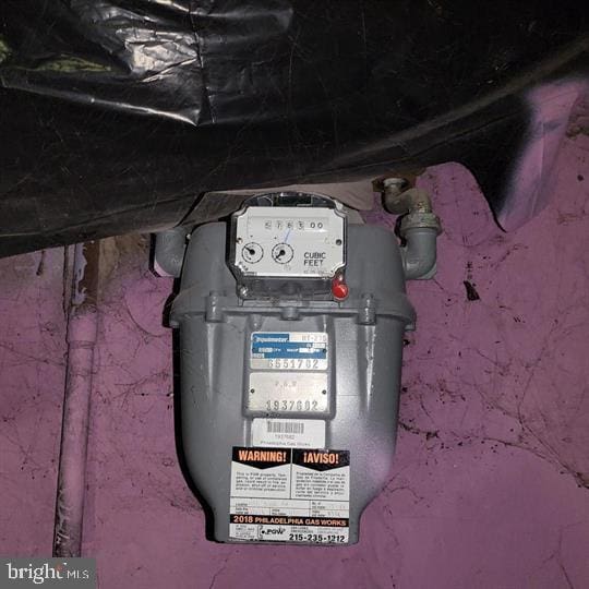 utility room featuring gas meter