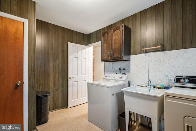 21 Princeton Ave, Gloucester City, NJ 08030 - clothes washing area featuring cabinet space, washer and clothes dryer, wood walls, and light colored carpet