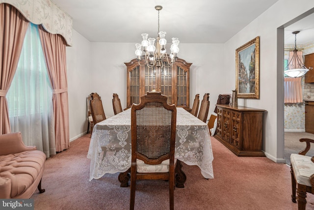21 Princeton Ave, Gloucester City, NJ 08030 - carpeted dining room featuring a chandelier and baseboards