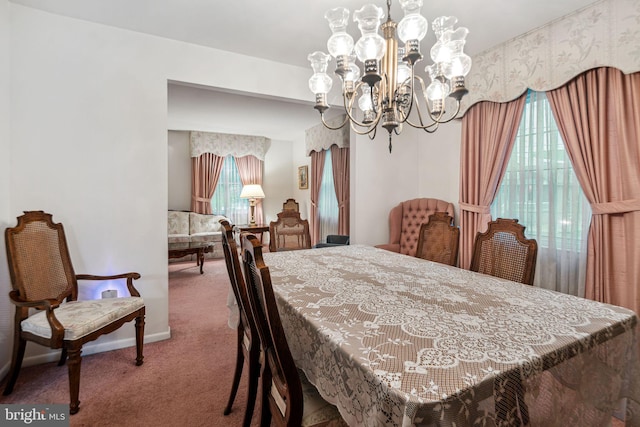 21 Princeton Ave, Gloucester City, NJ 08030 - carpeted dining area featuring a chandelier and baseboards
