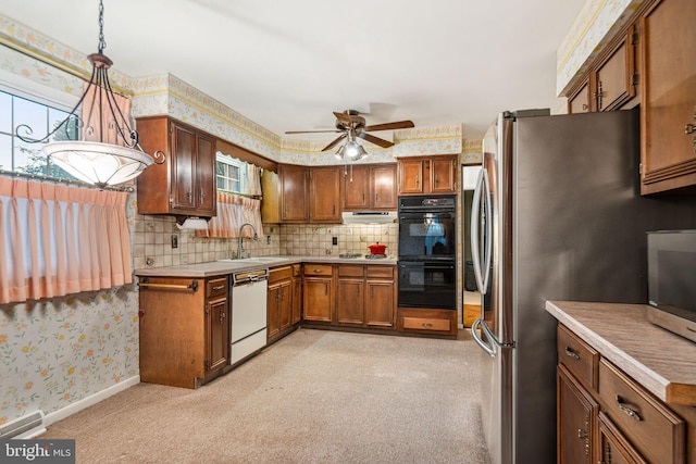 21 Princeton Ave, Gloucester City, NJ 08030 - kitchen featuring appliances with stainless steel finishes, wallpapered walls, plenty of natural light, a ceiling fan, and light countertops
