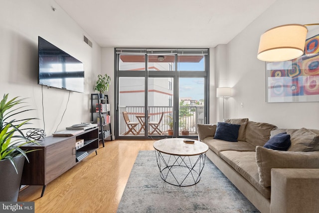 2120 Vermont Ave NW Unit 411, Washington, DC 20001 - living area with light wood-style flooring and expansive windows