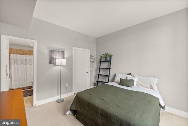 2120 Vermont Ave NW Unit 411, Washington, DC 20001 - carpeted bedroom with baseboards and ensuite bathroom