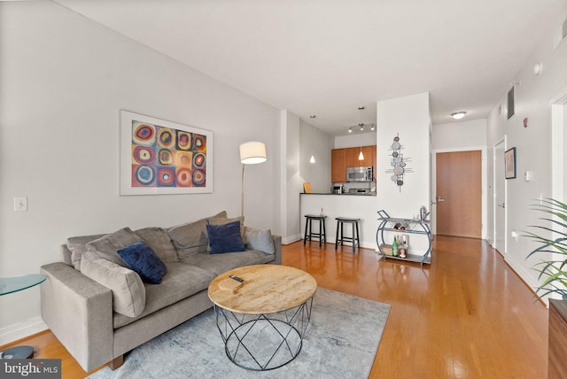 2120 Vermont Ave NW Unit 411, Washington, DC 20001 - living room with light wood-type flooring and baseboards