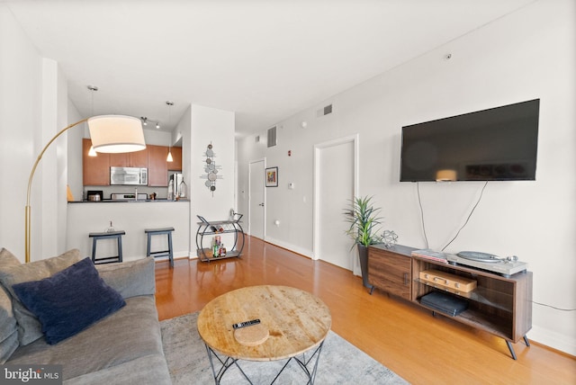 2120 Vermont Ave NW Unit 411, Washington, DC 20001 - living room featuring light wood-style flooring and baseboards