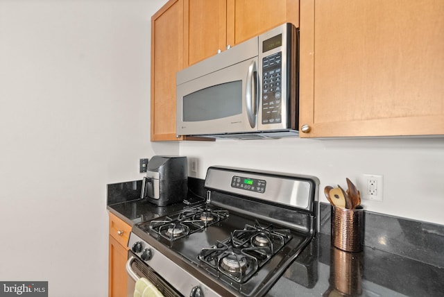 2120 Vermont Ave NW Unit 411, Washington, DC 20001 - kitchen featuring stainless steel appliances and dark countertops