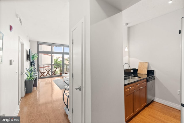 2120 Vermont Ave NW Unit 411, Washington, DC 20001 - hall featuring a sink, light wood-style flooring, and baseboards