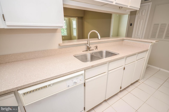 3313 Wyndham Cir Unit 4209, Alexandria, VA 22302 - kitchen with white dishwasher, a sink, light tile patterned floors, and white cabinets