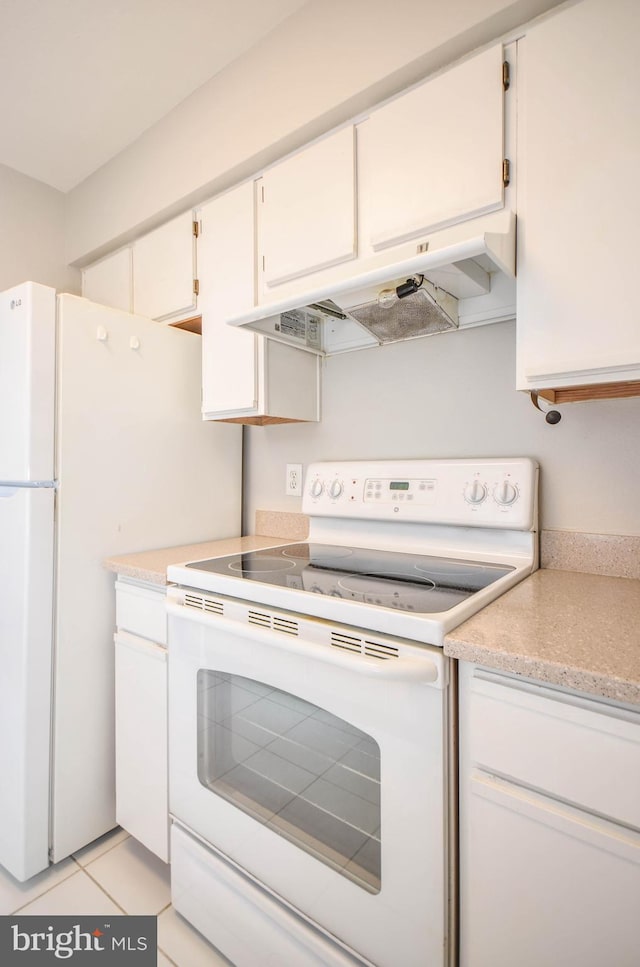 3313 Wyndham Cir Unit 4209, Alexandria, VA 22302 - kitchen featuring white appliances, light countertops, white cabinetry, and under cabinet range hood