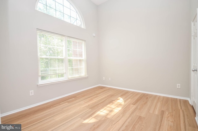 3313 Wyndham Cir Unit 4209, Alexandria, VA 22302 - spare room featuring plenty of natural light, light wood finished floors, and baseboards