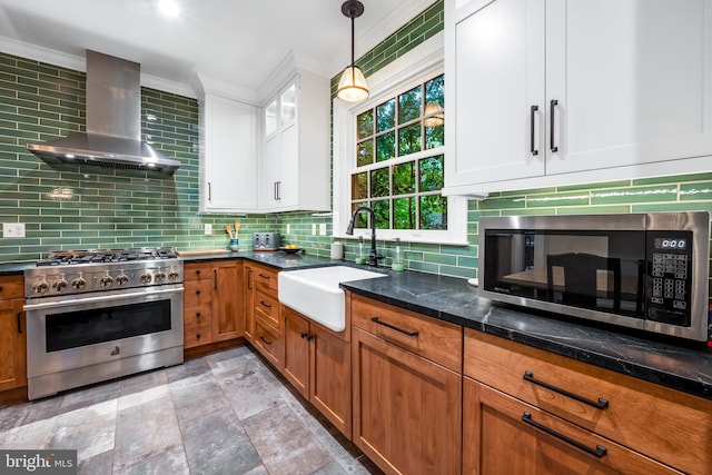 109 Deepdene Rd, Baltimore, MD 21210 - kitchen with stainless steel appliances, wall chimney range hood, a sink, decorative backsplash, and white cabinets