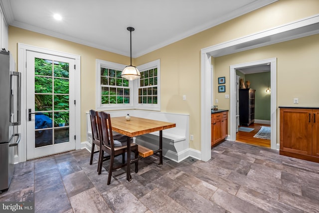 109 Deepdene Rd, Baltimore, MD 21210 - dining space featuring stone tile floors, baseboards, and ornamental molding