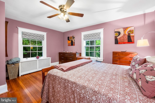 109 Deepdene Rd, Baltimore, MD 21210 - bedroom featuring radiator, wood finished floors, baseboards, and ceiling fan