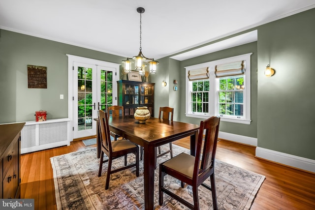 109 Deepdene Rd, Baltimore, MD 21210 - dining room featuring healthy amount of natural light, baseboards, wood finished floors, and crown molding