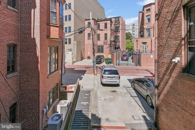 view of street featuring sidewalks, street lighting, and curbs