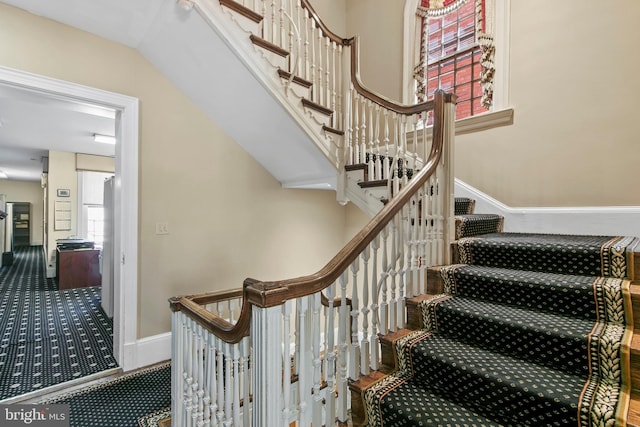 staircase with baseboards