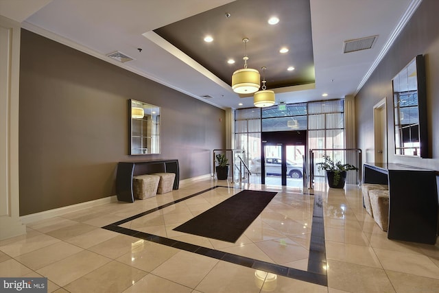 lobby featuring ornamental molding and recessed lighting