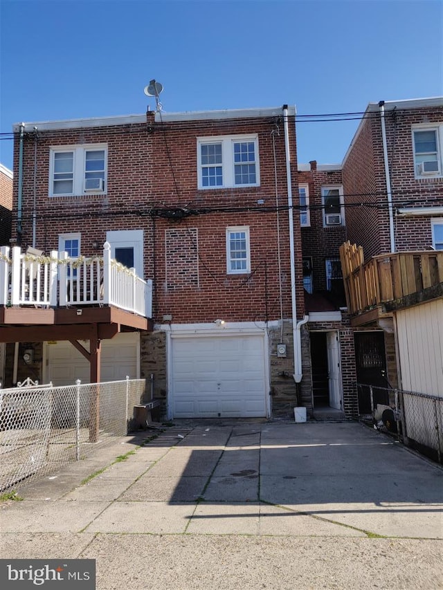 3138 Longshore Ave, Philadelphia, PA 19149 - back of house with concrete driveway, brick siding, and an attached garage