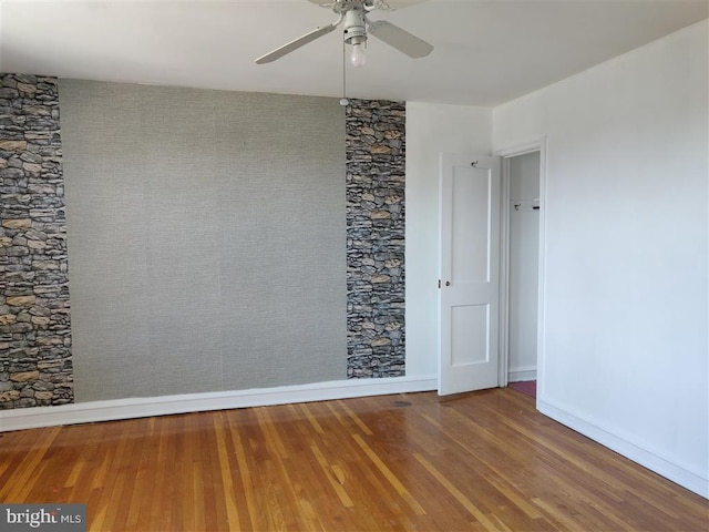 3138 Longshore Ave, Philadelphia, PA 19149 - unfurnished room with wood finished floors, ceiling fan, and baseboards