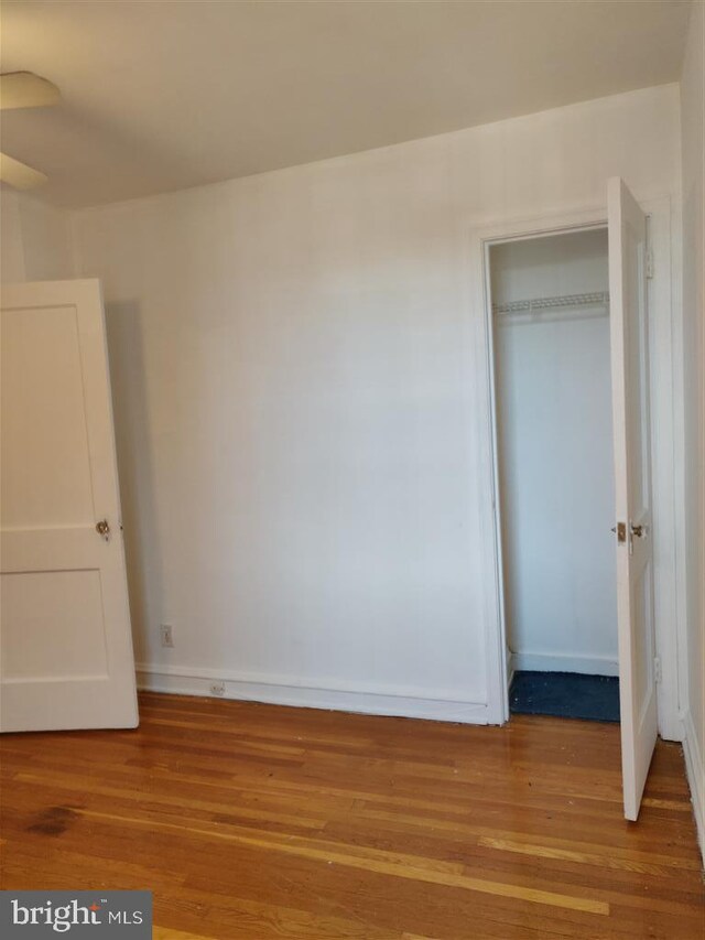 3138 Longshore Ave, Philadelphia, PA 19149 - unfurnished bedroom featuring wood finished floors, baseboards, and a closet