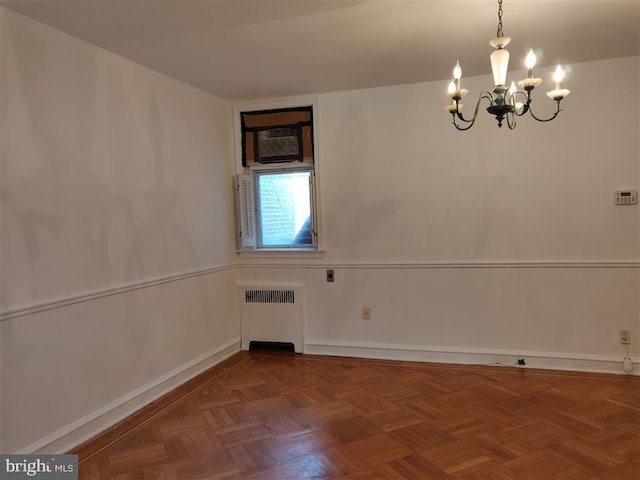 3138 Longshore Ave, Philadelphia, PA 19149 - spare room featuring radiator, a chandelier, a wall mounted AC, and baseboards