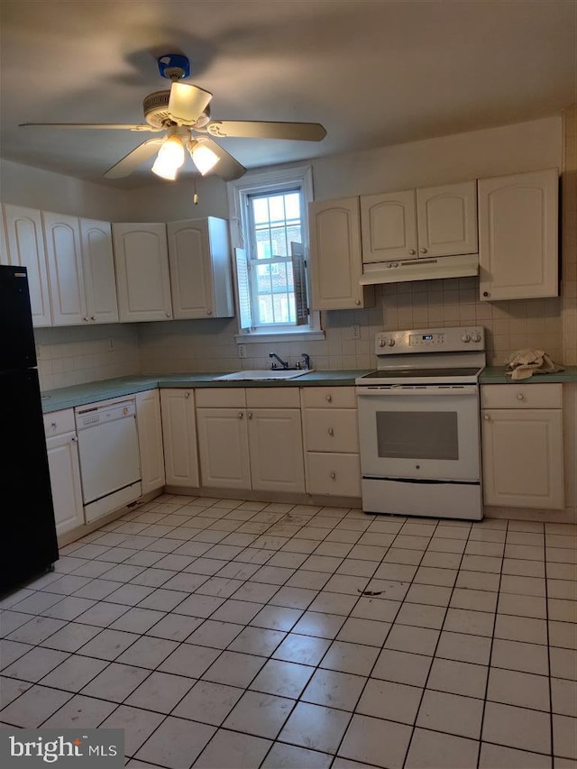 3138 Longshore Ave, Philadelphia, PA 19149 - kitchen featuring white appliances, under cabinet range hood, tasteful backsplash, and white cabinets