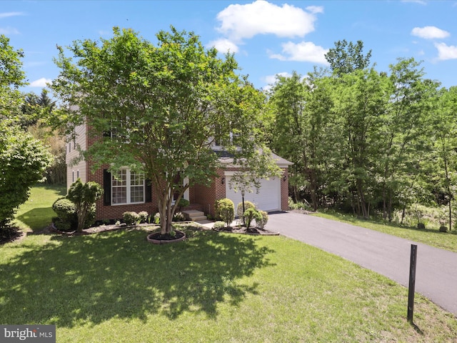 obstructed view of property featuring brick siding, driveway, a front lawn, and an attached garage