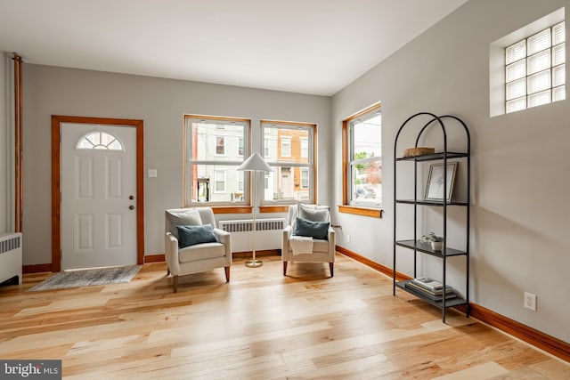 308 Cherry St, Columbia, PA 17512 - living area with radiator, light wood-type flooring, and baseboards