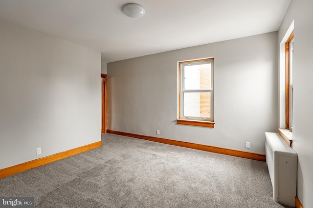 308 Cherry St, Columbia, PA 17512 - carpeted empty room featuring baseboards and radiator heating unit