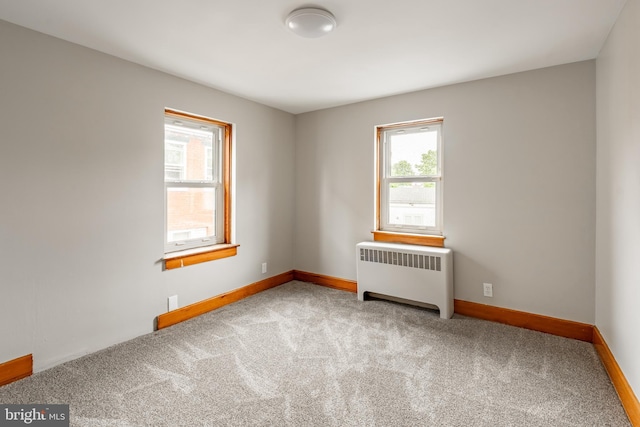 308 Cherry St, Columbia, PA 17512 - empty room featuring radiator, carpet, and baseboards
